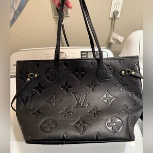 Black leather LV tote bag